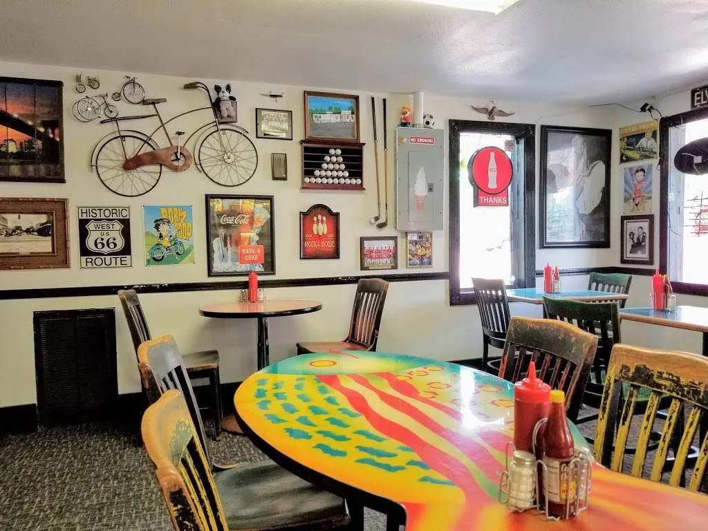 Colorful tables and vintage signs inside Pete’s Burger Place